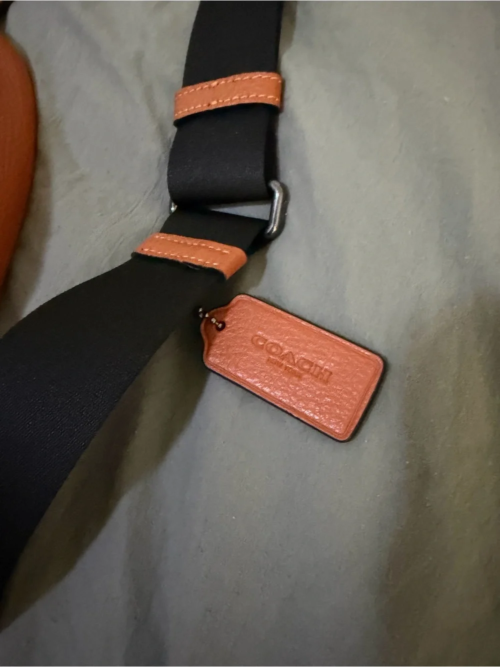 Coach Orange Leather Sling Bag with Black Strap and wristlet new without tags